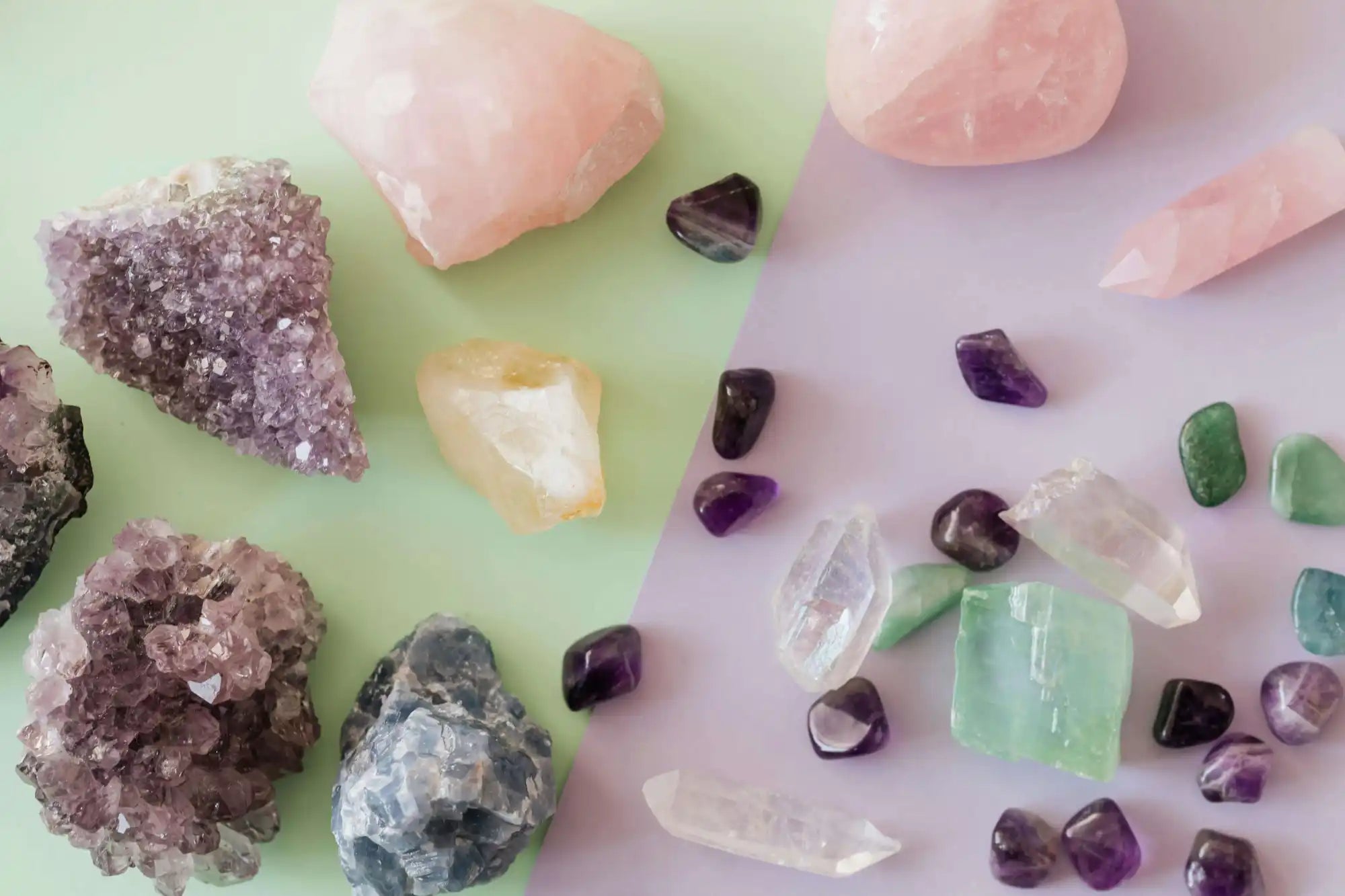 A collection of crystals and gemstones in various colors including pink, purple, and green.