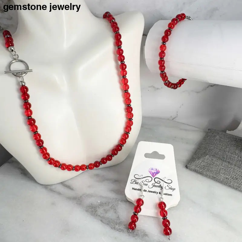 red matching necklace and bracelet earrings